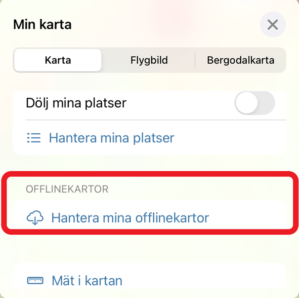 Skärmklipp som visar valet "Hantera mina offlinekartor" i blå text, med en ikon föreställande ett moln med en pil nedåt i.